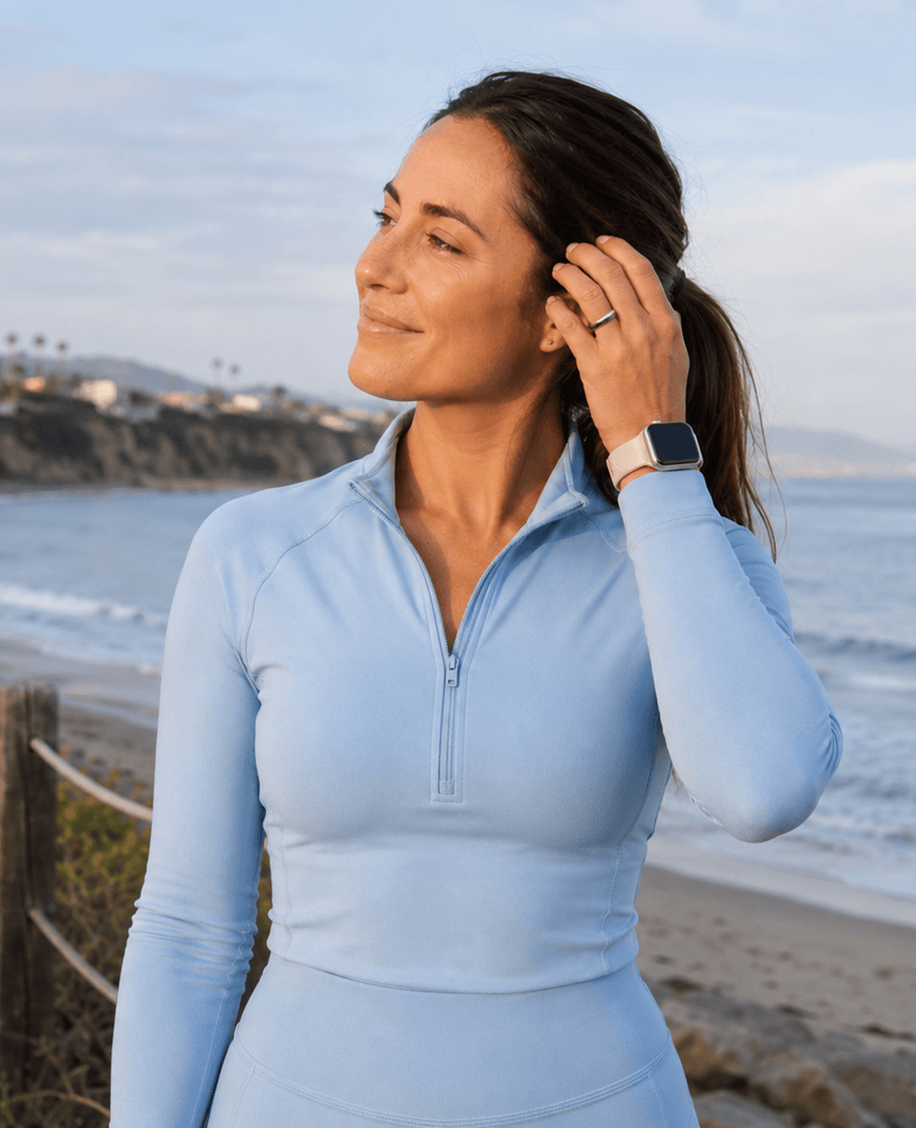 Woman outdoors checking her smartwatch